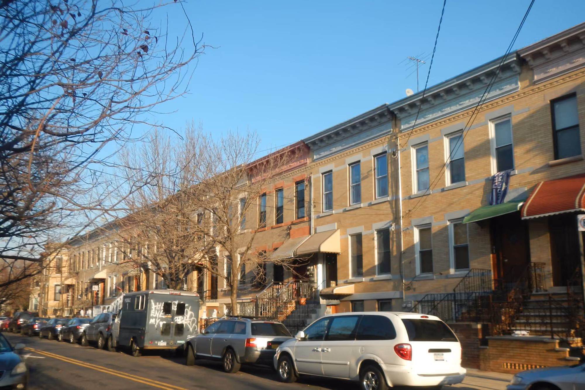 Brick rowhouses along De Kalb Avenue in Bushwick