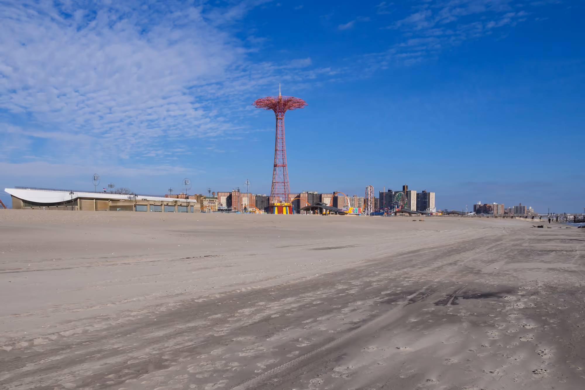 Coney Island beach and boardwalk with the Parachute Jump in the distance