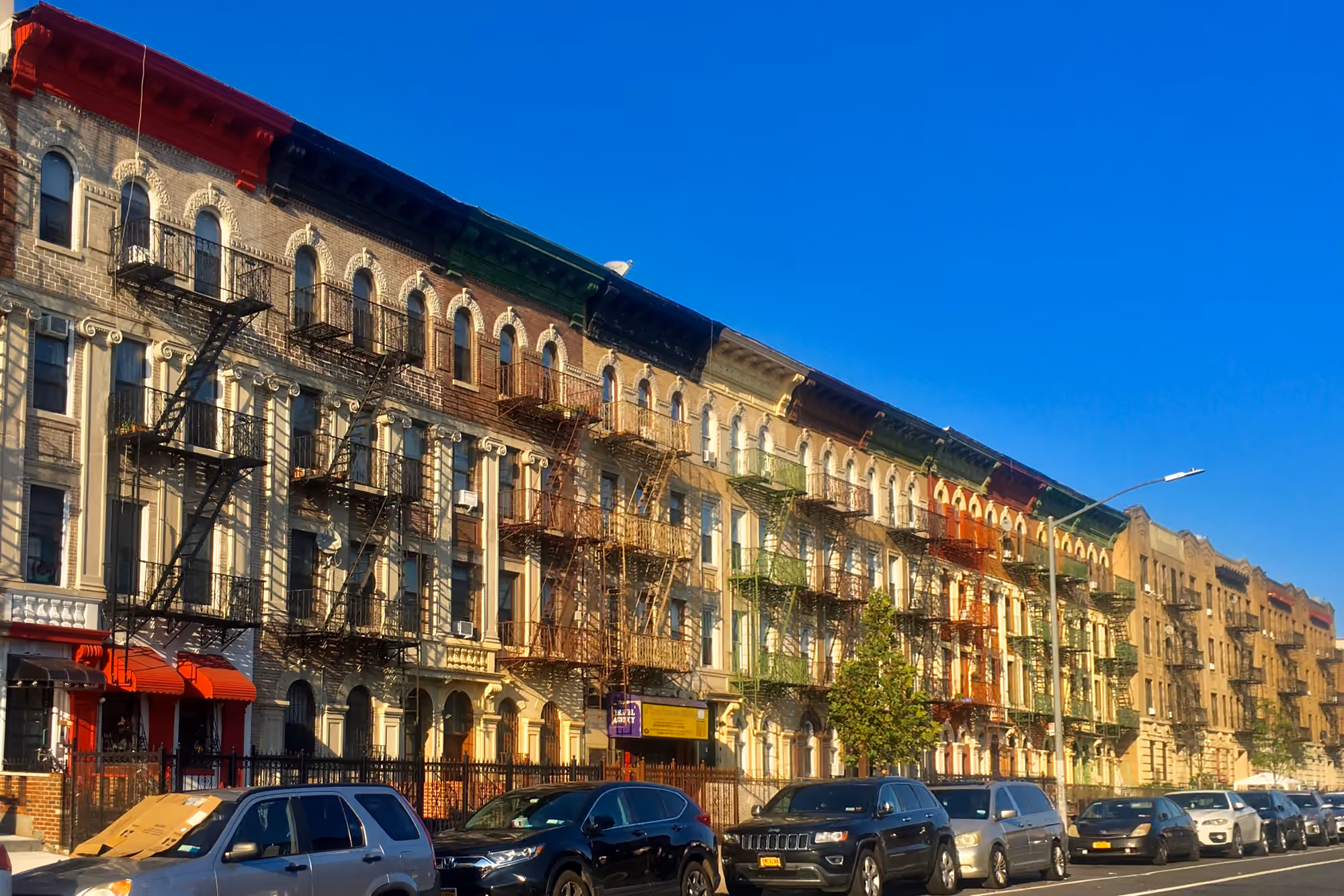 A row of historic apartment facades along St. John's Place in Crown Heights