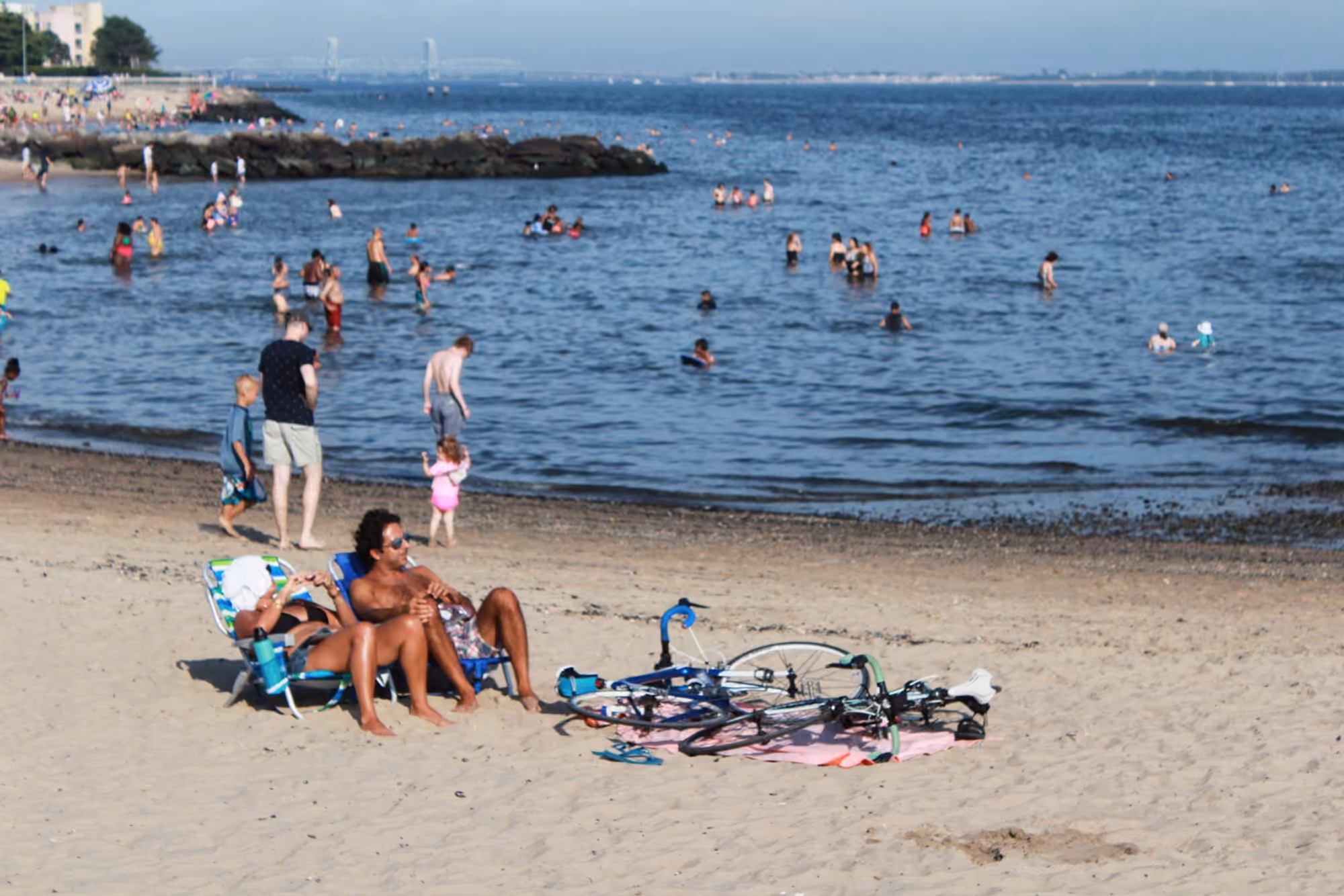 Beachgoers and the shoreline at Manhattan Beach in Brooklyn