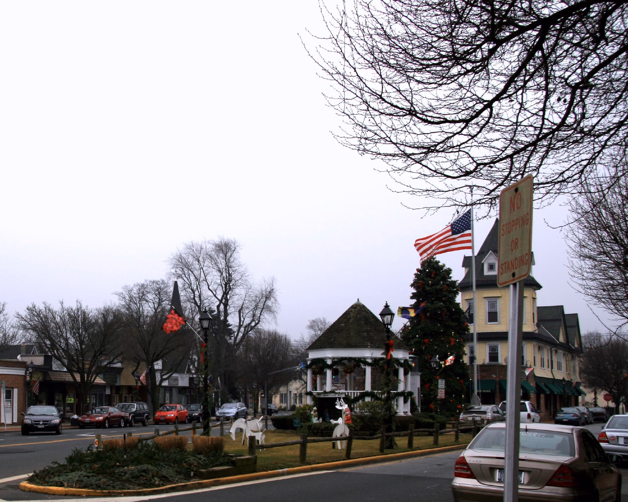 Amityville Town Square with gazebo, historic building, and Christmas decorations