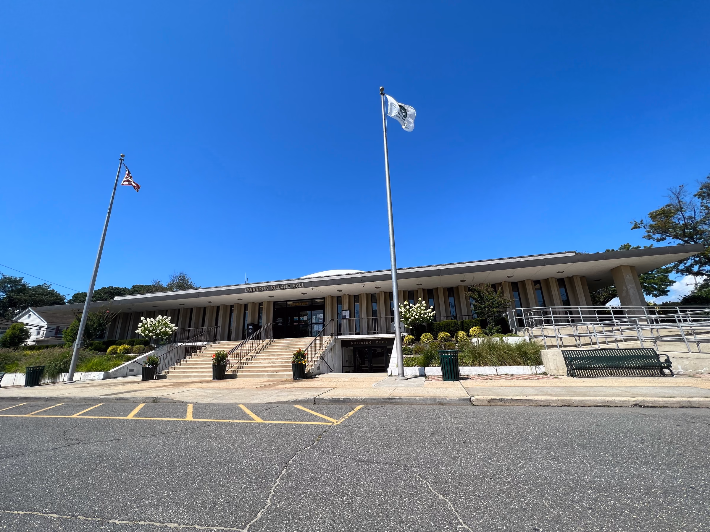 Lynbrook Village Hall under a blue summer sky