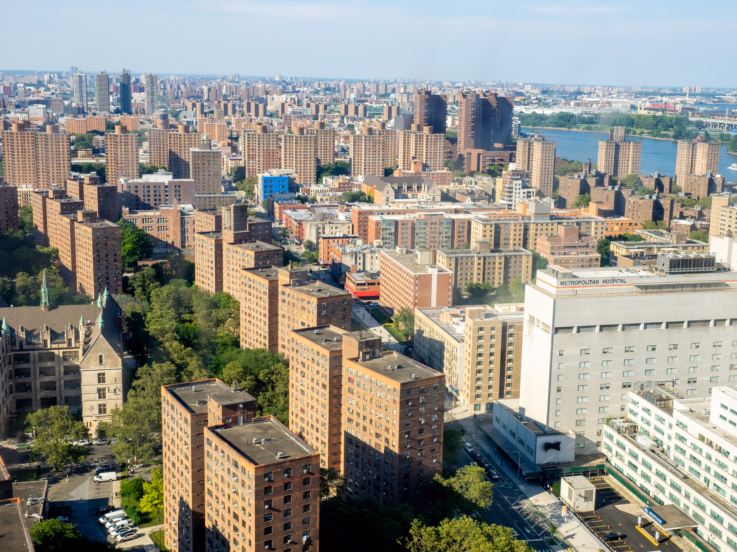 Aerial view over East Harlem’s apartment buildings toward the East River.