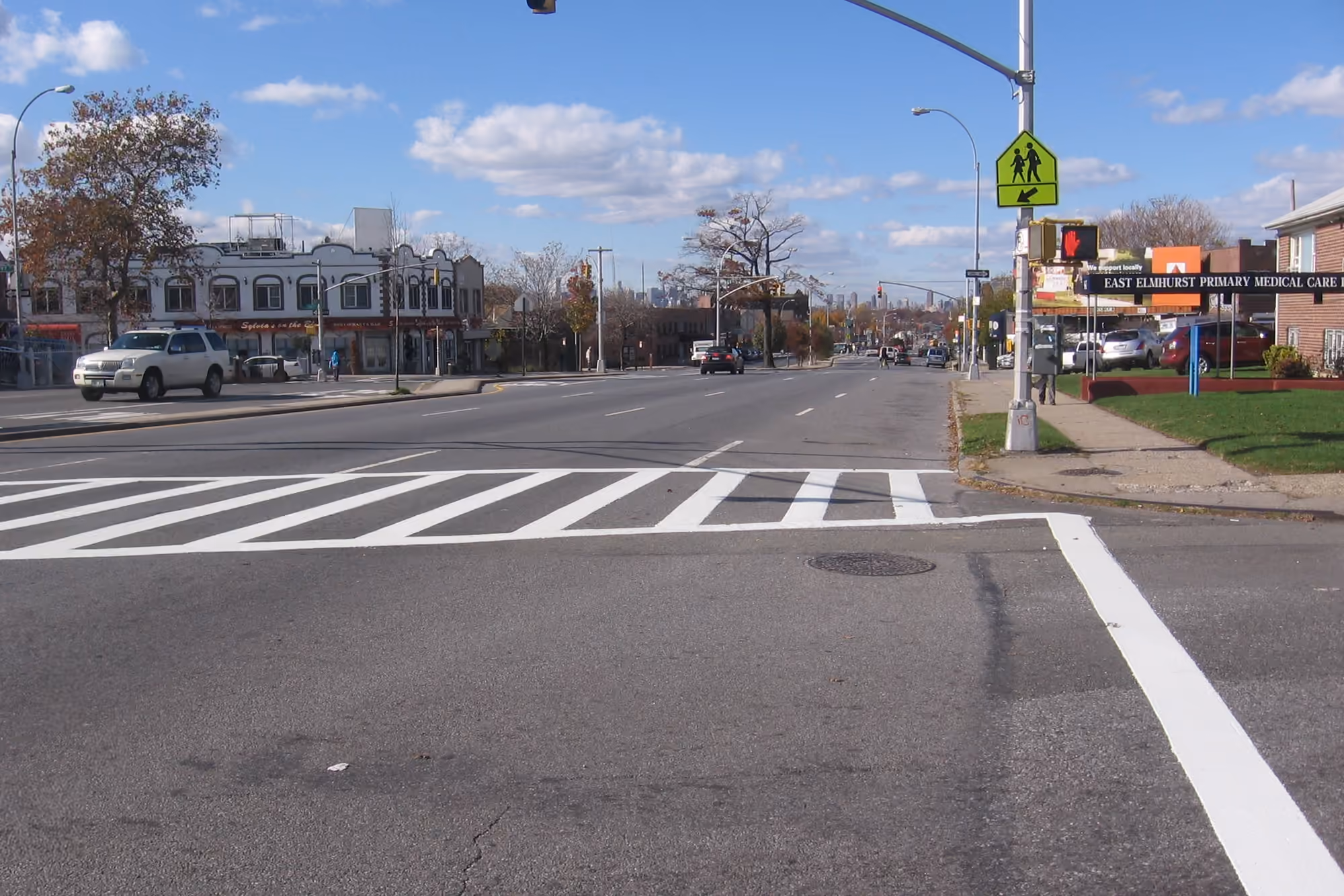 Residential and commercial streets along Astoria Boulevard in East Elmhurst