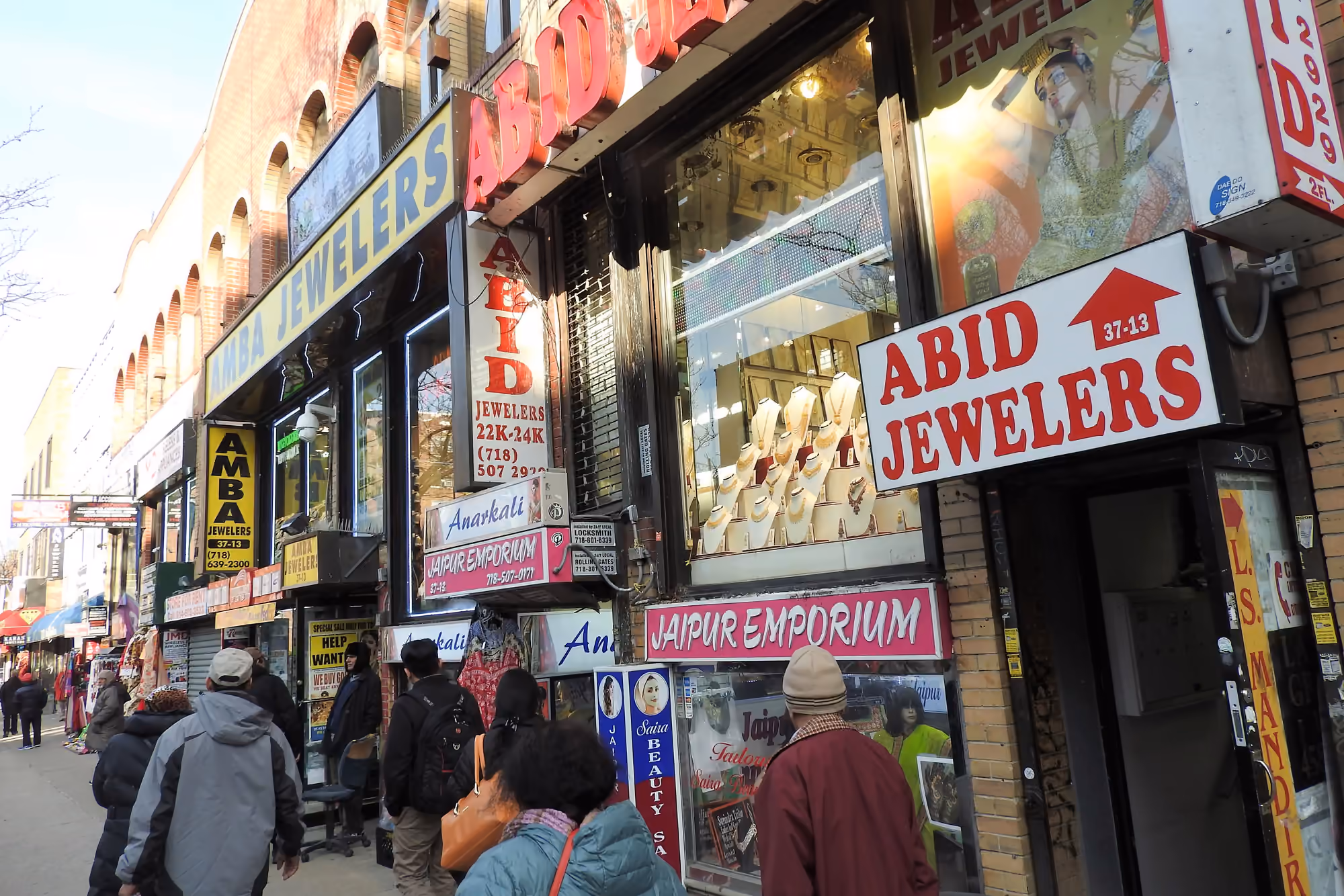 Shops and pedestrians along 74th Street in Jackson Heights