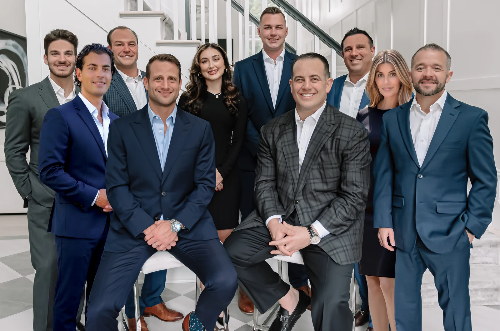 The Pesce & Lanzillotta Group together on a grand staircase